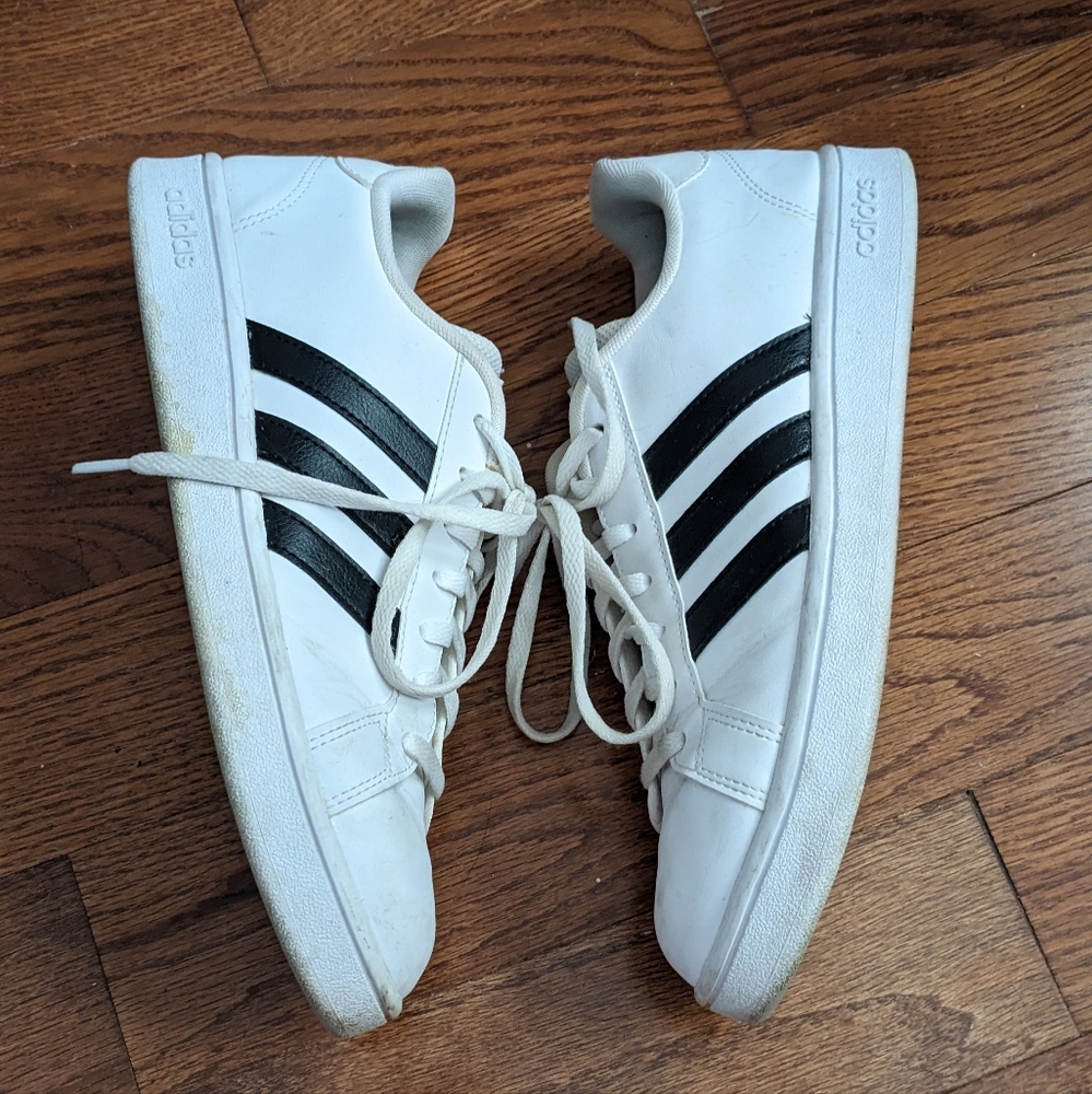 Classic Adidas sneakers white with black stripes on one side women's size 9.5